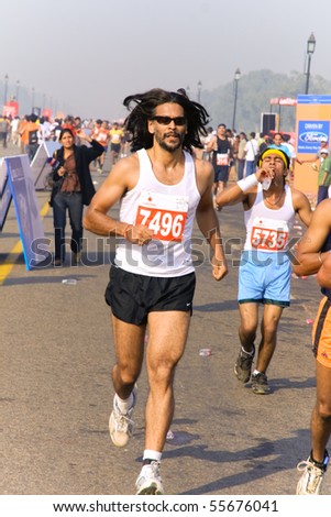DELHI - OCTOBER 28: Man running during crowded Delhi Half Marathon on October 28, 2007 in Delhi, India. The 2009 event attracted around 29,000 runners.