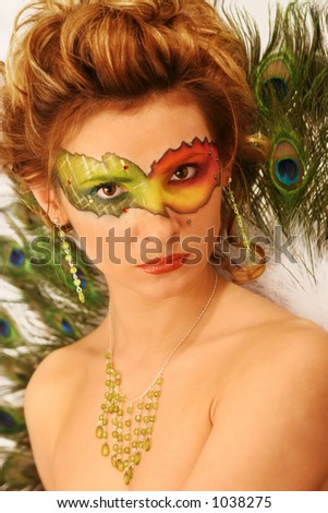 stock photo : face with multicolored makeup and peacock's fun