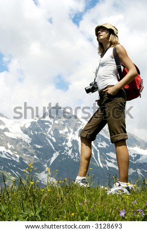 woman in mountains and see on high peak