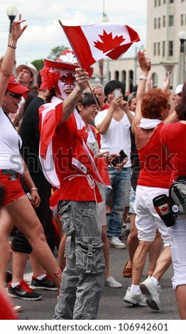 OTTAWA, CANADA - JULY 1: People celebrating in the street on Canada Day, July 1, 2012 in Ottawa, Ontario. Canada Day is a national holiday, and is celebrated each July 1st across the country.