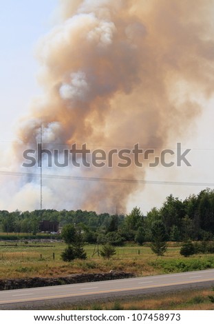 One of two forest fires burning on July 12, 2012 within the city of Ottawa, Ontario. Much of this part of Canada has experienced one of the hottest and driest years on record.