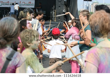 OTTAWA, CANADA-AUGUST 11: People learning Dandiya at the Festival of India on August 11, 2012 in Ottawa, Ontario. Dandiya is an Indian dance where participants bang sticks together to music.