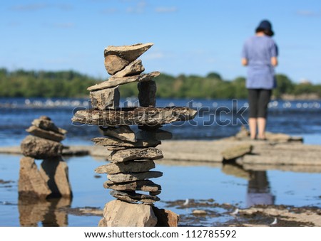 OTTAWA, CANADA - AUGUST 18: Piles of balanced stones at the International Stone Balance Festival at Remic Rapids and the Ottawa River on August 18, 2012 in Ottawa, Ontario.