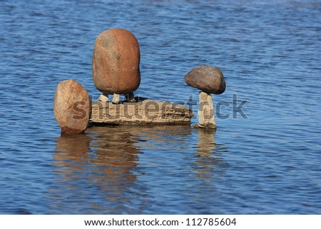 OTTAWA, CANADA - AUGUST 18: A small group of balanced stones at the International Stone Balance Festival at Remic Rapids and the Ottawa River on August 18, 2012 in Ottawa, Ontario.