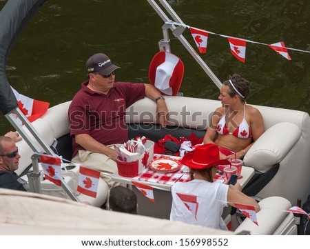 OTTAWA, CANADA - JULY 1: People relaxing on a boat during Canada Day on July 1, 2013 in downtown Ottawa, Ontario.