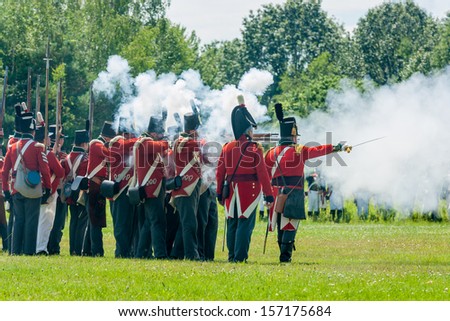 MORRISBURG, CANADA - JULY 14: Men firing guns during the Battle of Crysler\'s Farm reenactment on July 14, 2013 near Morrisburg, Ontario.