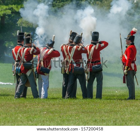 MORRISBURG, CANADA - JULY 14: Men firing muskets during the Battle of Crysler\'s Farm reenactment on July 14, 2013 near Morrisburg, Ontario.