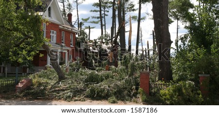 House damaged by falling trees. Aftermath of Ontario windstorm 2006. Mattawa, Ontario.