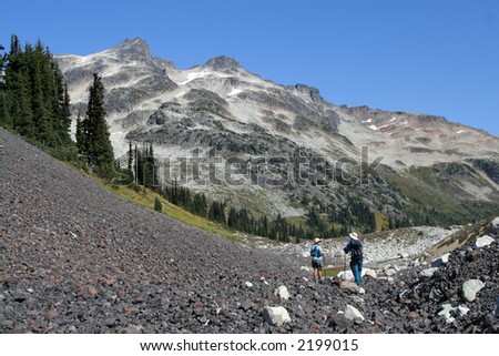 Man and woman hiking in British Columbia. Mount Callaghan. Canada.