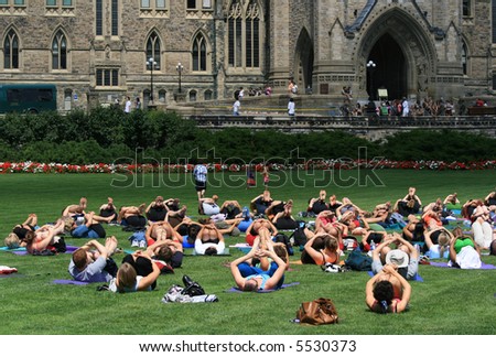 People doing yoga on Parliament Hill. Ottawa, Ontario. Canada.