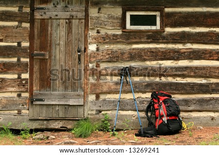 A backpack outside a rustic cabin. Ontario, Canada.