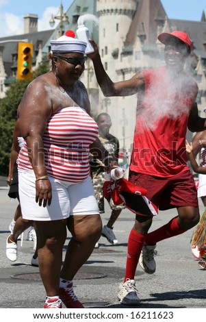 OTTAWA, ON - AUGUST 16: People having fun in the Caribe-Expo Street Parade on August 16, 2008 in Ottawa, Ontario, Canada.