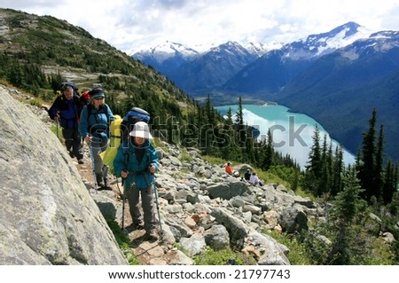Backpackers on the High Note Trail above Cheakamus Lake near Whistler, British Columbia, Canada.