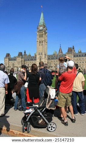 OTTAWA, ONTARIO, CANADA - AUGUST 4: People watching the Governor General\'s Foot Guards during Changing of the Guard on Parliament Hill on August 4, 2008 in downtown Ottawa, Ontario, Canada.