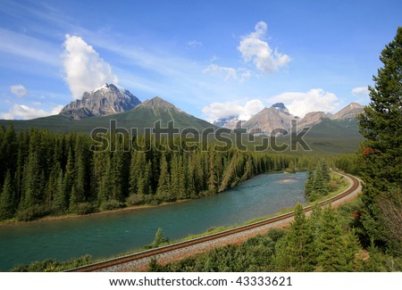 A railroad along the Bow River near Lake Louise in Banff National Park, Alberta, Canada.