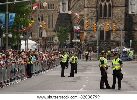 OTTAWA, CANADA - JUNE 30: Police and crowds await the arrival of William and Kate in downtown Ottawa on June 30, 2011 during the first stop of their royal tour of Canada.