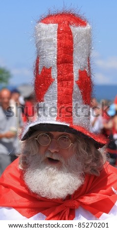 OTTAWA, CANADA – JULY 1: An unidentified man is in the spirit of Canada Day on July 1, 2011 in downtown Ottawa, Ontario. Canada Day is celebrated annually and is a national holiday.