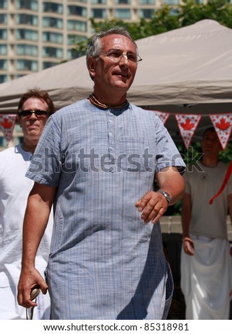 OTTAWA, CANADA – JULY 1: An unidentified Hare Krishna member chants during Canada Day festivities on July 1, 2011 in downtown Ottawa, Ontario. Canada Day is a national holiday and is celebrated annually.