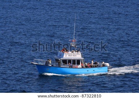 ST. ANTHONY, CANADA – JULY 26: People on a Northland Discovery boat tour on July 26, 2011 in St. Anthony, Newfoundland. It was a good year for tour operators in the area due to the number of icebergs.
