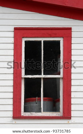 An upper window in the Roberts Store Heritage Building, a Newfoundland Fisheries Heritage building, in Woody Point, Newfoundland, Canada.