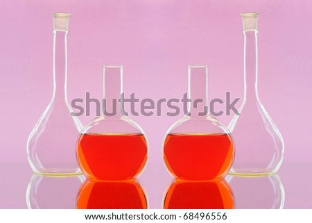 Four flasks on a laboratory table