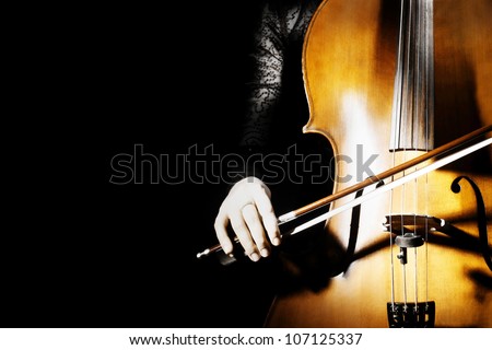 Cello classical music instrument of orchestra. Cellist on black background