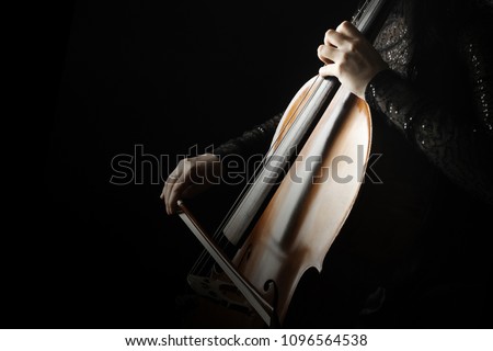 Cello player. Cellist hands playing cello  orchestra music instrument closeup