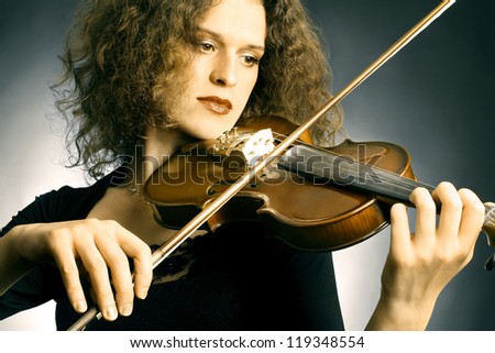 Violin playing violinist musician. Woman classical musical instrument player