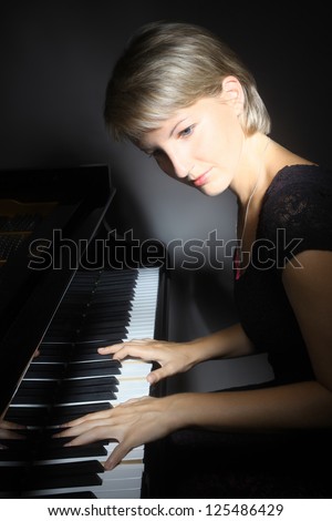 Piano playing pianist player. Woman with classical musical instrument