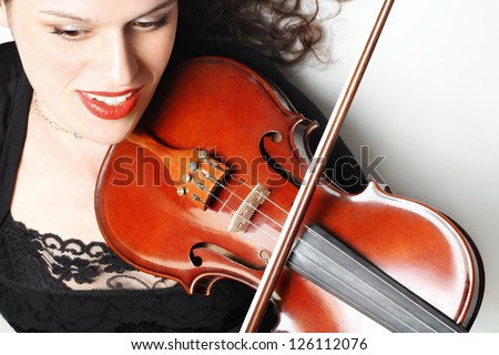 Violin player musician violinist. Expressive woman with musical instruments music playing