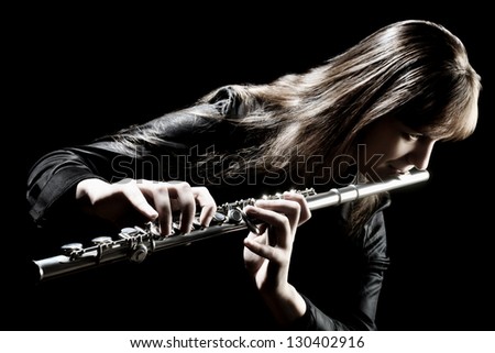 Flute music flutist instrument playing. Classical orchestra musician. Focus is on the hands with instrument