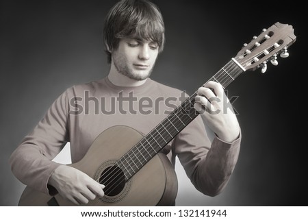 Guitar acoustic guitarist player. Classical musical instrument man music playing