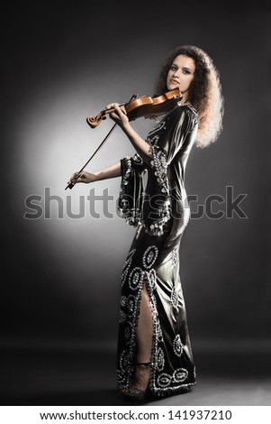 Music performer with violin. Woman musician classical player