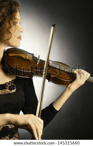 Violin player classical violinist. Orchestra musical instruments music playing