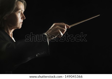 Orchestra conductor hands baton. Music director holding stick