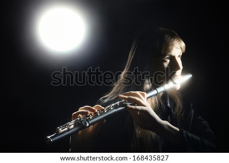 Flute music classical musician player  Flutist with musical instrument in darkness