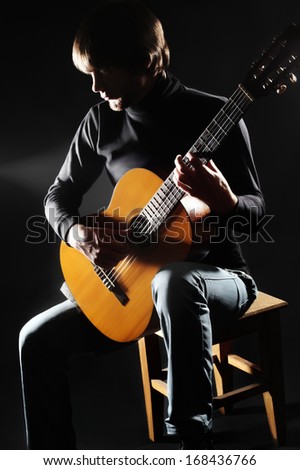 Acoustic guitar player guitarist playing. Man with classical guitar musical instrument