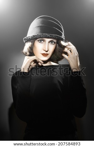 Elegant woman in hat. Retro fashion vintage portrait stylish lady