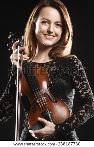 Beautiful woman with violin Player violinist portrait with music instrument.
