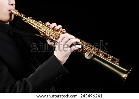 Music instrument Saxophone. Saxophonist classical musician with soprano sax closeup isolated