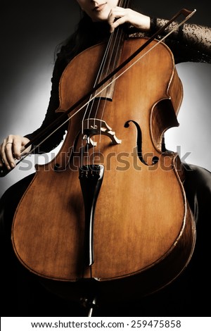 Cello music instrument orchestra player cellist playing classic. Closeup of cello with bow in hands