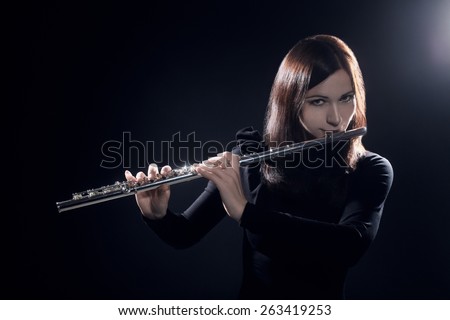 Flute player flutist playing music instrument flute classical musician