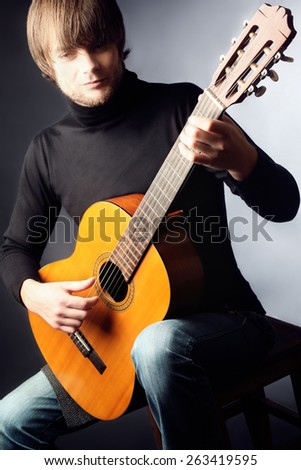 Acoustic guitar player guitarist man classical guitar playing