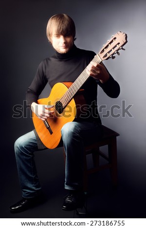 Acoustic guitar player guitarist man classical guitar playing
