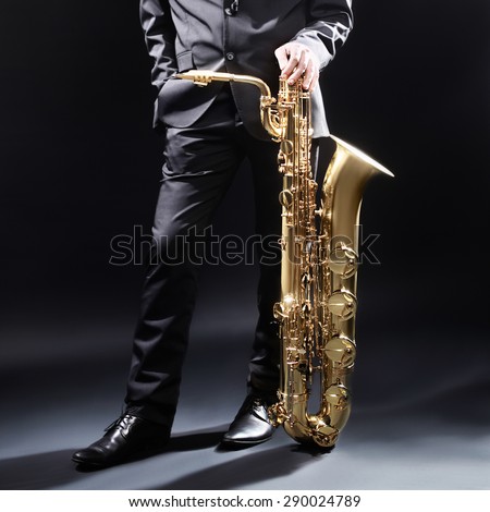 Saxophone player Jazz man Saxophonist with baritone sax jazz musician