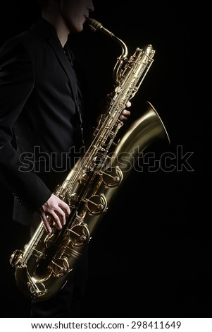 Saxophone Jazz Music Instrument Saxophonist with Baritone Sax player isolated on black