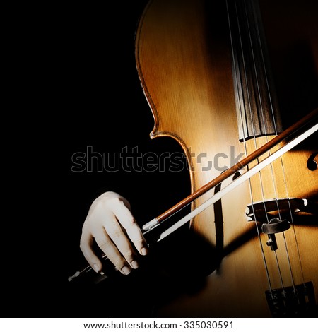 Cello player cellist playing music instrument hands closeup. Orchestra instruments isolated