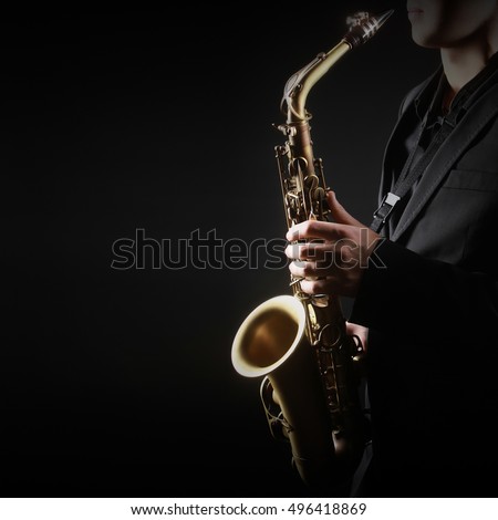 Saxophone Player Saxophonist playing jazz music with Sax alto