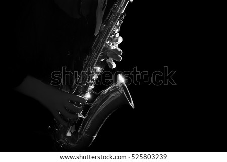 Saxophone Player hands Saxophonist playing jazz music. Alto sax musical instrument close up