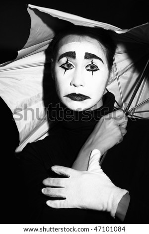 Melancholic Actor Mime In Dramatic Makeup With Umbrella. Black And